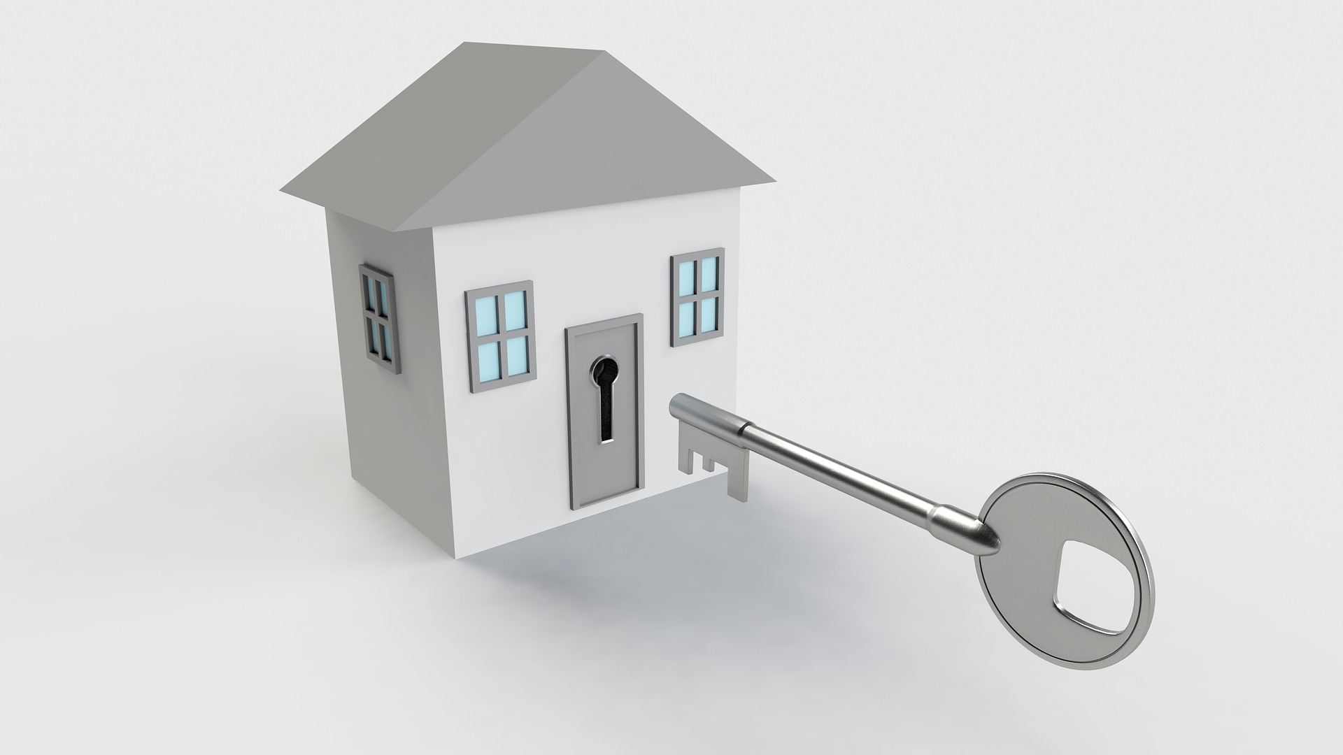 una casa, frente a ella una llave.
